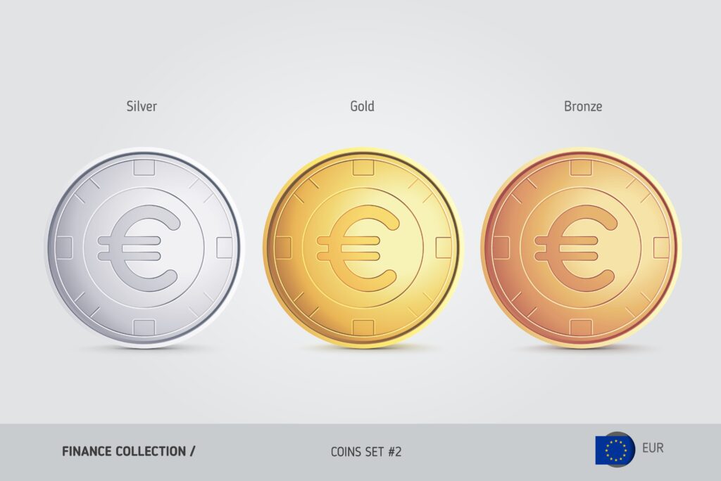 This image shows the same euro coin in three different metals: silver, gold, and bronze. The coins are shown front-facing and are designed with the euro symbol on a plain surface, a grooved outer rim, and an inner border. While this coin set is a stylized representation, real euro coins are standardized in color and material.